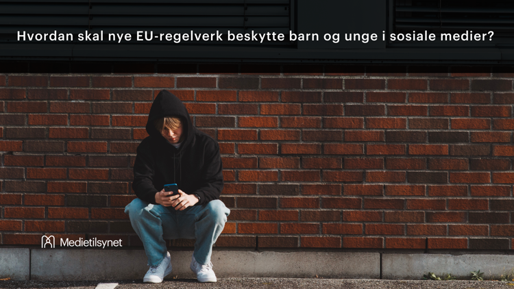 A teenager wearing a hoodie sits alone by a brick wall, looking down at their phone. At the top of the image, the text reads: “How will new EU regulations protect children and young people on social media?” In the bottom left corner, the logo of the Norwegian Media Authority is displayed.